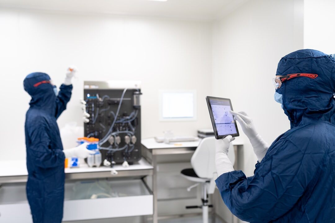 Researchers working in a modern laboratory with scientific equipment